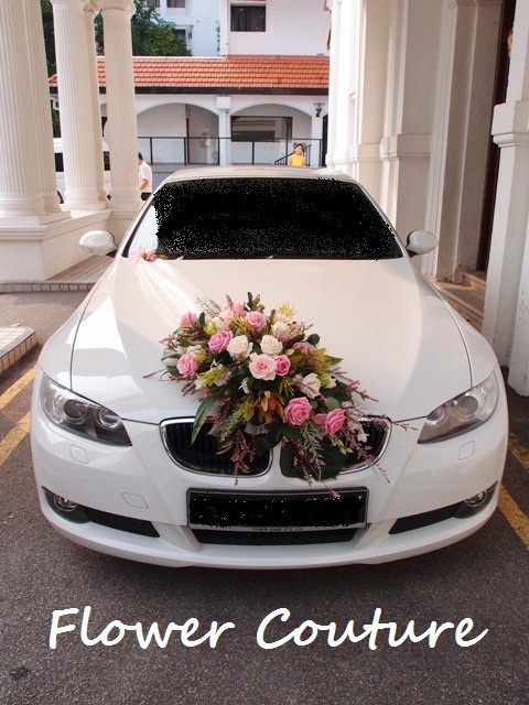 Here is a behindthescene look at how flower decoration for a wedding car